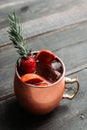 Red oranges and strawberry cocktail in copper mug variation of Moscow mule on the wooden background Royalty Free Stock Photo