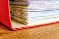 Red ordner or document binder with paperwork Royalty Free Stock Photo