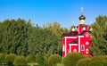 Red, an Orthodox church on a blue sky background. Royalty Free Stock Photo