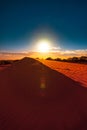 Red sand dune with ripple and blue sky Royalty Free Stock Photo