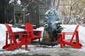 Red Outdoor Chairs with Smoking Fire Pit during Winter Royalty Free Stock Photo