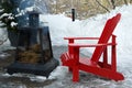 Red Outdoor Chairs with Smoking Fire Pit during Winter Royalty Free Stock Photo