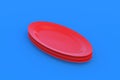 Red oval plates on blue background