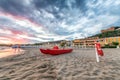 Red paddle boat on the seaside at sunset Royalty Free Stock Photo