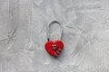 Red padlock or love lock on gray background, heart shaped Royalty Free Stock Photo