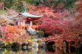 Red pagoda and red bridge with pond and color change maple trees in Daigoji temple in autumn season on November in Kyoto, Japan. Royalty Free Stock Photo