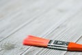 Red paint brush on grey wooden background Royalty Free Stock Photo