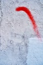 Revolt sign in red on a ruined wall of white cement