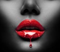 Red Paint drips from the lips, lipgloss dripping from sexy lips, bright liquid drops on beautiful model girl`s mouth, black skin