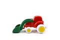 red paint plastic toy bulldozer with green universal blade isolated on white Royalty Free Stock Photo