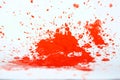 Red paint splat on a white back ground.