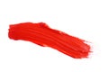 Red paint stroke drawn with brush on white background, top view Royalty Free Stock Photo