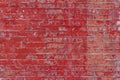 Red painted antique brick wall background with weathered appearance Royalty Free Stock Photo