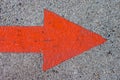 Red Painted Arrow on Concrete