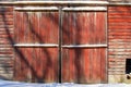 Red painted barn doors. Royalty Free Stock Photo