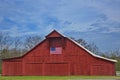 A red  barn with the U.S. American flag Royalty Free Stock Photo