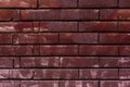 Red painted brick wall background aged vandalism graffiti suburban texture Royalty Free Stock Photo