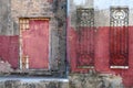 Red painted dirty warehouse alley door rusted concrete steps Royalty Free Stock Photo