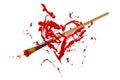 Red painted heart pierced by paintbrush