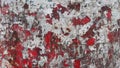 Red painted metal surface with torn pieces of paper and rust Royalty Free Stock Photo