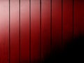 red painted retro shed barn wall dark shadow shine shiny door evening glow