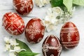 Red painted Ukrainian Easter eggs with jasmine