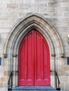 Red Wooden Doors on Sandstone Church, Sydney, Australia Royalty Free Stock Photo