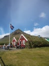 Red painted wooden houses with grass roof in Arnastapi, Snaefellsnes, Iceland