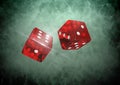 Red Pair of dice on green vignette Royalty Free Stock Photo