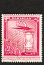 Red Pakistan Postage Stamp with Hourglass