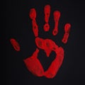 Red palm print on black background with heart, stop bloodshed and war, peace concept