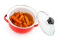 Red pan with carrots Royalty Free Stock Photo