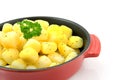 Red pan with fresh baked potatoes Royalty Free Stock Photo