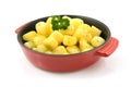 Red pan with fresh baked potatoes Royalty Free Stock Photo