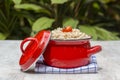 Red pan with wheat porridge - traditional meal in Ukraine, Belarus and Russia