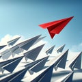 A red paper airplane is flying through a group of white paper airplanes