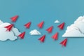 Red paper airplanes flying on blue sky and cloud, business success and leadership creative concept Royalty Free Stock Photo