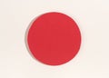 Red paper circle with shadow on white background. Royalty Free Stock Photo