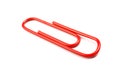 Red office metal clip isolated on white background business object symbol accessory paperclip paper supply macro paperwork closeup