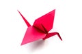 Red paper crane origami isolated on a white background