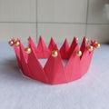 Red Paper Crown Origami Crafts, Yellow Pearl, Queen Princess Kid Toys Royalty Free Stock Photo