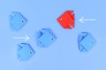 Red paper fish swimming swimming against the current in opposite direction Royalty Free Stock Photo