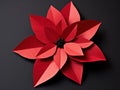 a red paper flower with black beads
