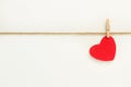 A red paper heart hanging from a sisal yarn Royalty Free Stock Photo