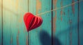 Red Paper Heart Hanging on String Against Blue Wall Royalty Free Stock Photo