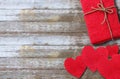 Red paper heart and red gift box on wooden table background Royalty Free Stock Photo