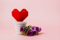 Red paper heart in white flower pot with purple rose bouquet Royalty Free Stock Photo