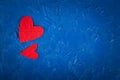 Red paper hearts on a blue background Valentine's Day