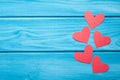 Red paper hearts on a blue wooden background. Valentine`s Day Royalty Free Stock Photo