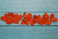 Red paper hearts on a blue wooden background Royalty Free Stock Photo